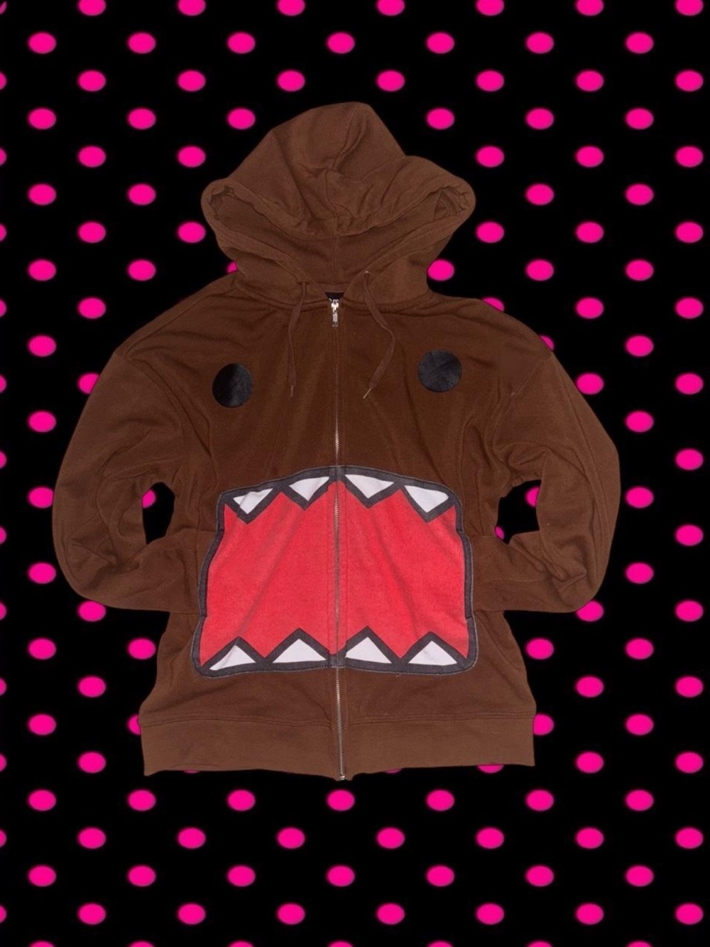 Brown Domo hoodie with red mouth graphic and white teeth
